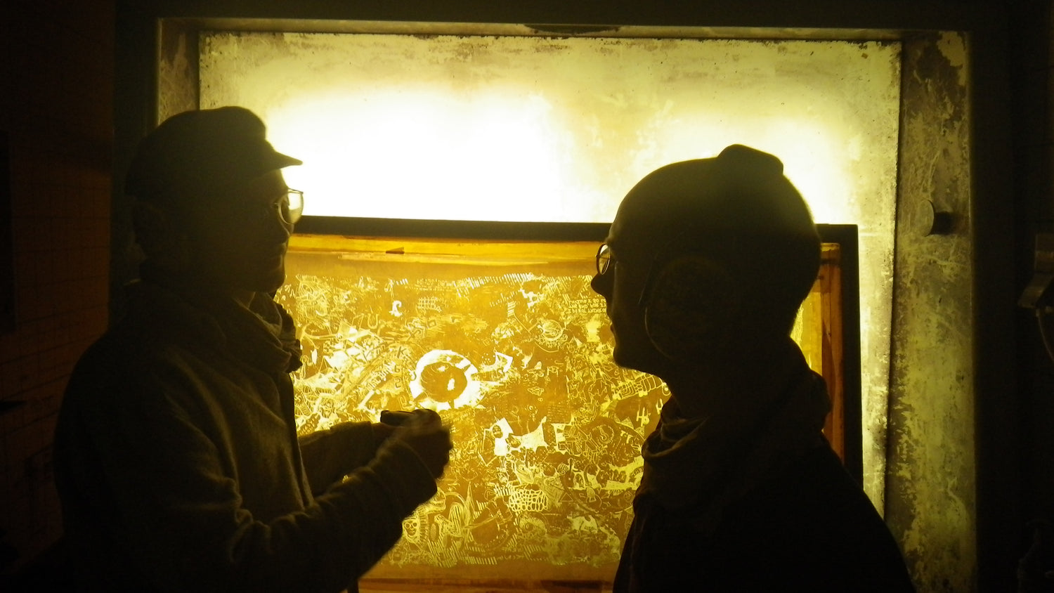 heiner in front of the backlit washing booth of the screenprint workshop in the art university berlin weißensee