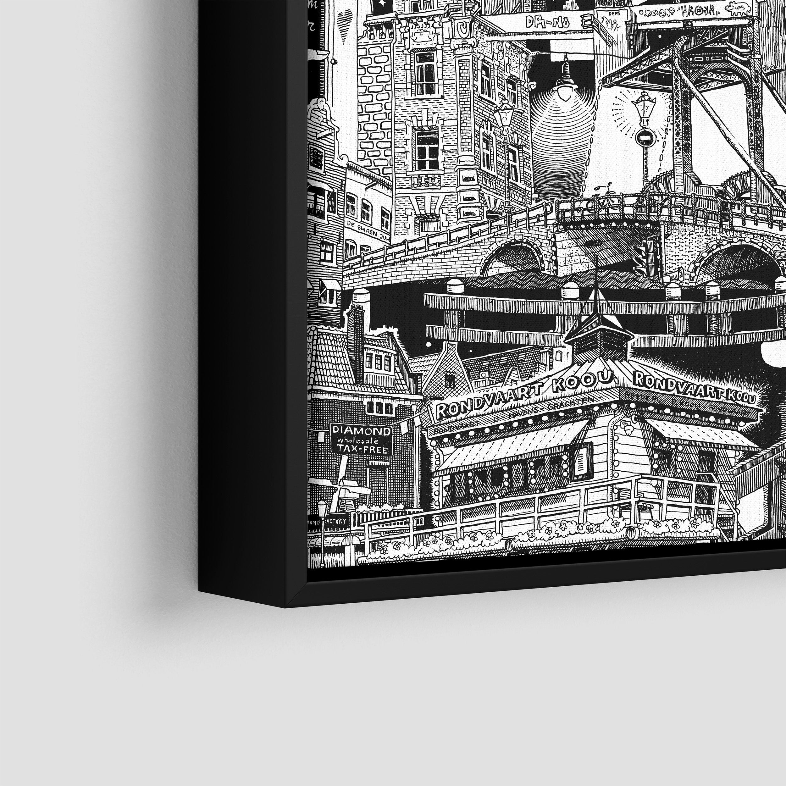 A small framed black-and-white Amsterdam artwork, hand-drawn on the streets, showcasing iconic urban scenes with a striking modern touch