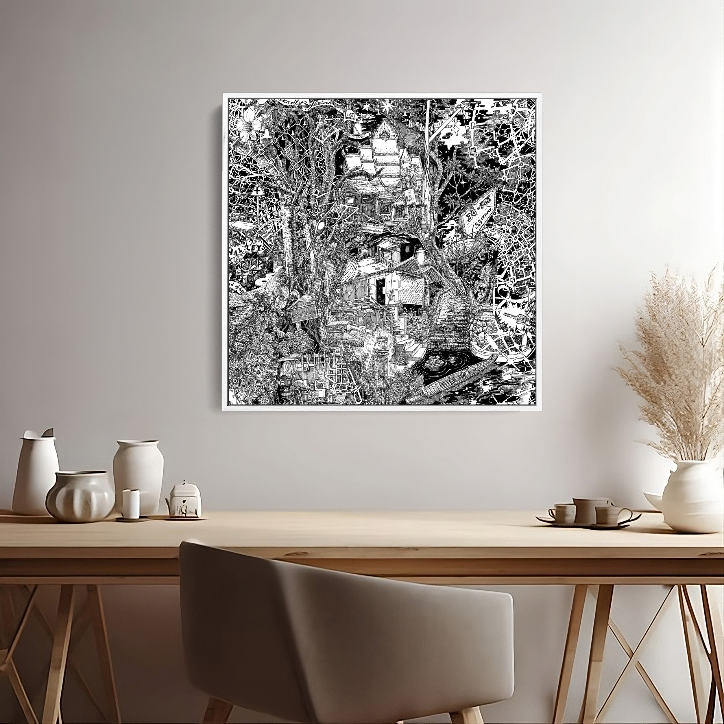 White-framed black-and-white canvas of Luang Prabang, showcasing jungle plants, traditional huts, and Laotian culture.