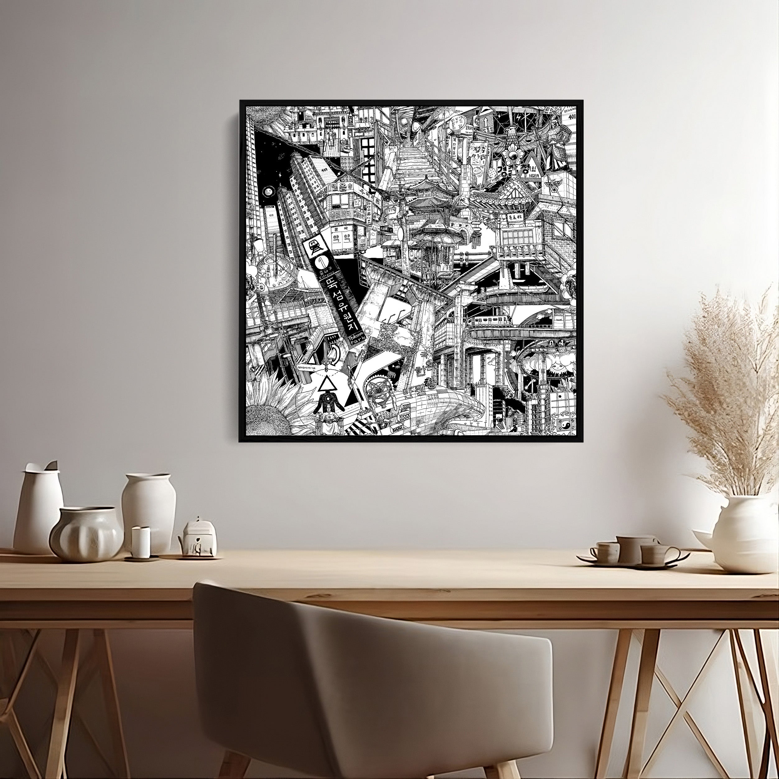 a small black-and-white canvas artwork with a black frame featuring a collage of Seoul’s urban landscapes, skyscrapers, writings, and other iconic touristic highlights from South Korea