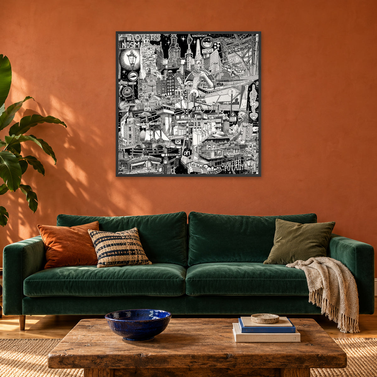 Amsterdam fine art poster 100 × 100 cm in a black wood frame above a green velvet sofa in a terracotta living room
