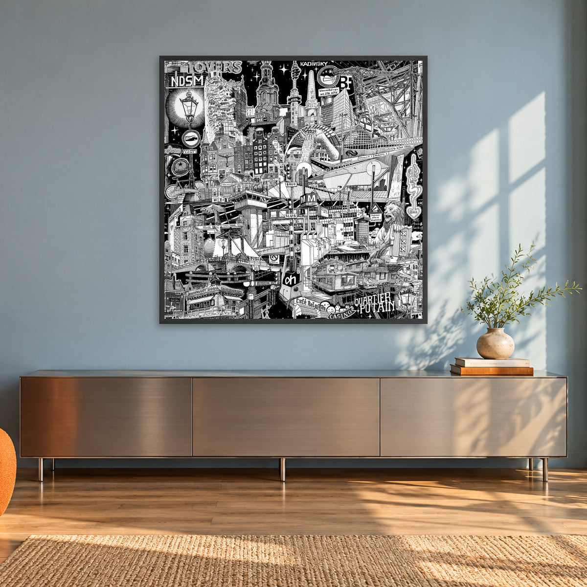 Amsterdam fine art poster 100 × 100 cm in a black wood frame in a sunlit loft with an orange armchair