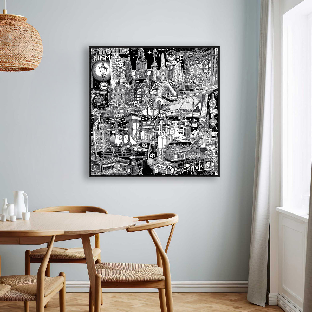 80 cm Amsterdam canvas in a black frame, a hand-drawn black-and-white cityscape capturing the canals, gabled houses and lively street atmosphere.