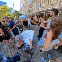 Heiner Radau drawing the NYC artwork on location near the Charging Bull on Wall Street in Lower Manhattan.