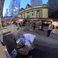 Heiner Radau live drawing on location at Grand Central Terminal, with the Transportation statue and Midtown Manhattan street scene.