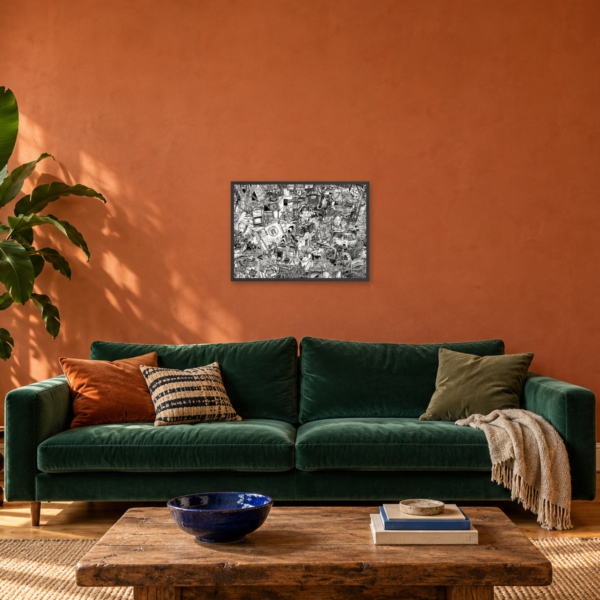 Hanoi fine art poster A2 landscape in a black wood frame above a green velvet sofa in a terracotta living room