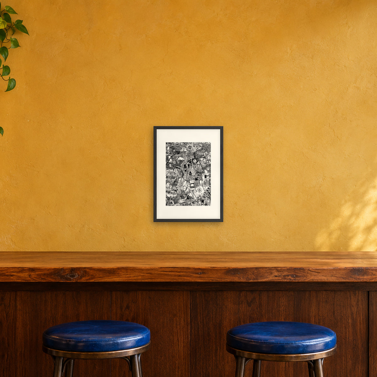 Hanoi fine art poster A3 portrait in a black wood frame with white passepartout above a café bar counter
