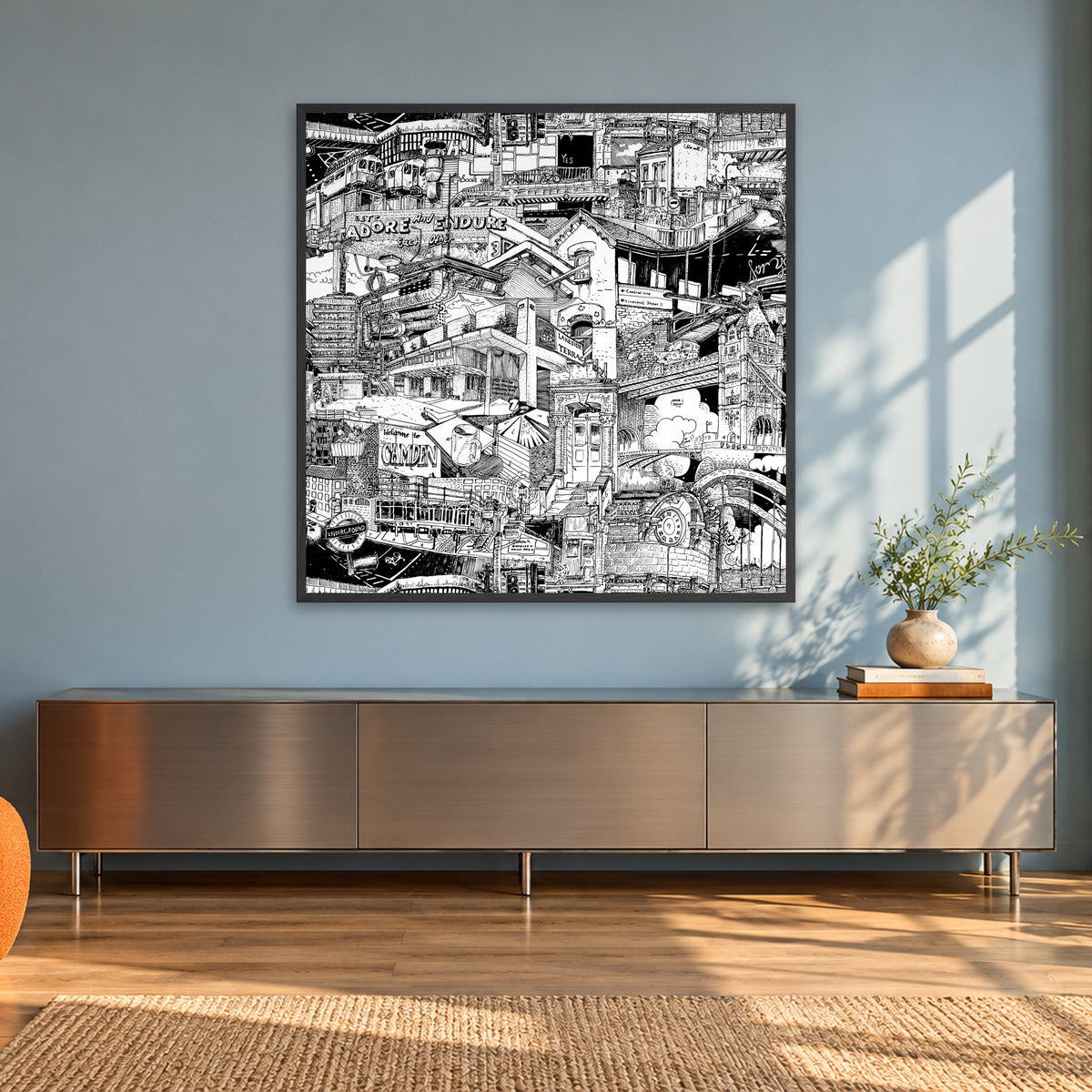 London fine art poster 100 × 100 cm in a black wood frame in a sunlit loft with an orange armchair