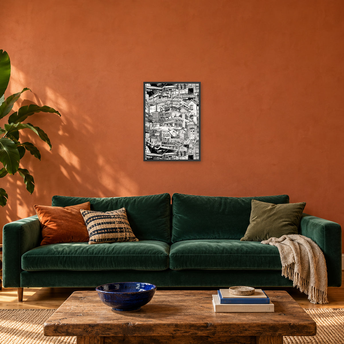 London fine art poster A2 portrait in a black wood frame above a green velvet sofa in a terracotta living room