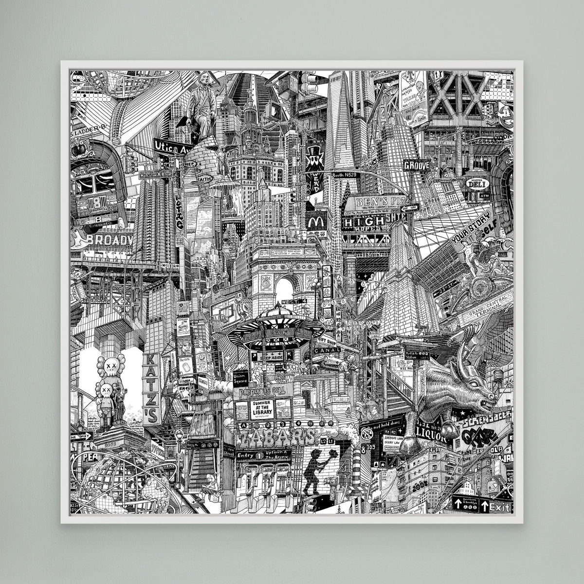 White framed NYC art print on a green wall with black and white buildings, subway elements, Union Square, Chinatown and Manhattan street signs.