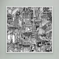 White framed NYC art print on a green wall with black and white buildings, subway elements, Union Square, Chinatown and Manhattan street signs.