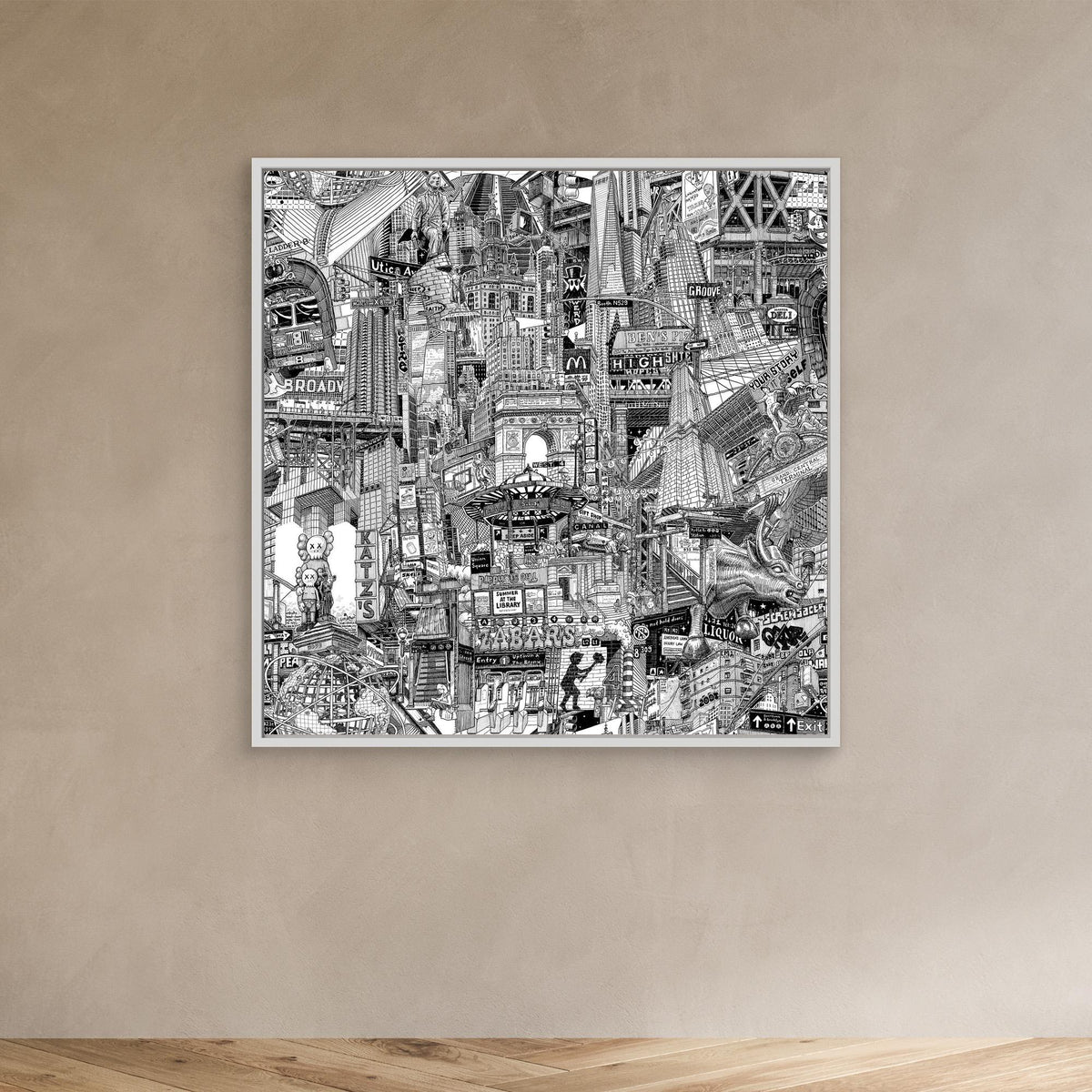 White framed NYC wall decor on a beige wall, featuring black and white travel art inspired by DUMBO, Brooklyn Bridge and New York street life.