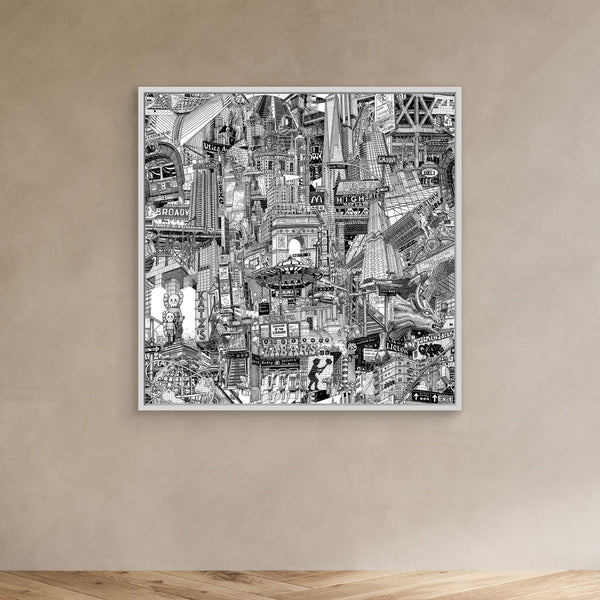 White framed NYC wall decor on a beige wall, featuring black and white travel art inspired by DUMBO, Brooklyn Bridge and New York street life.