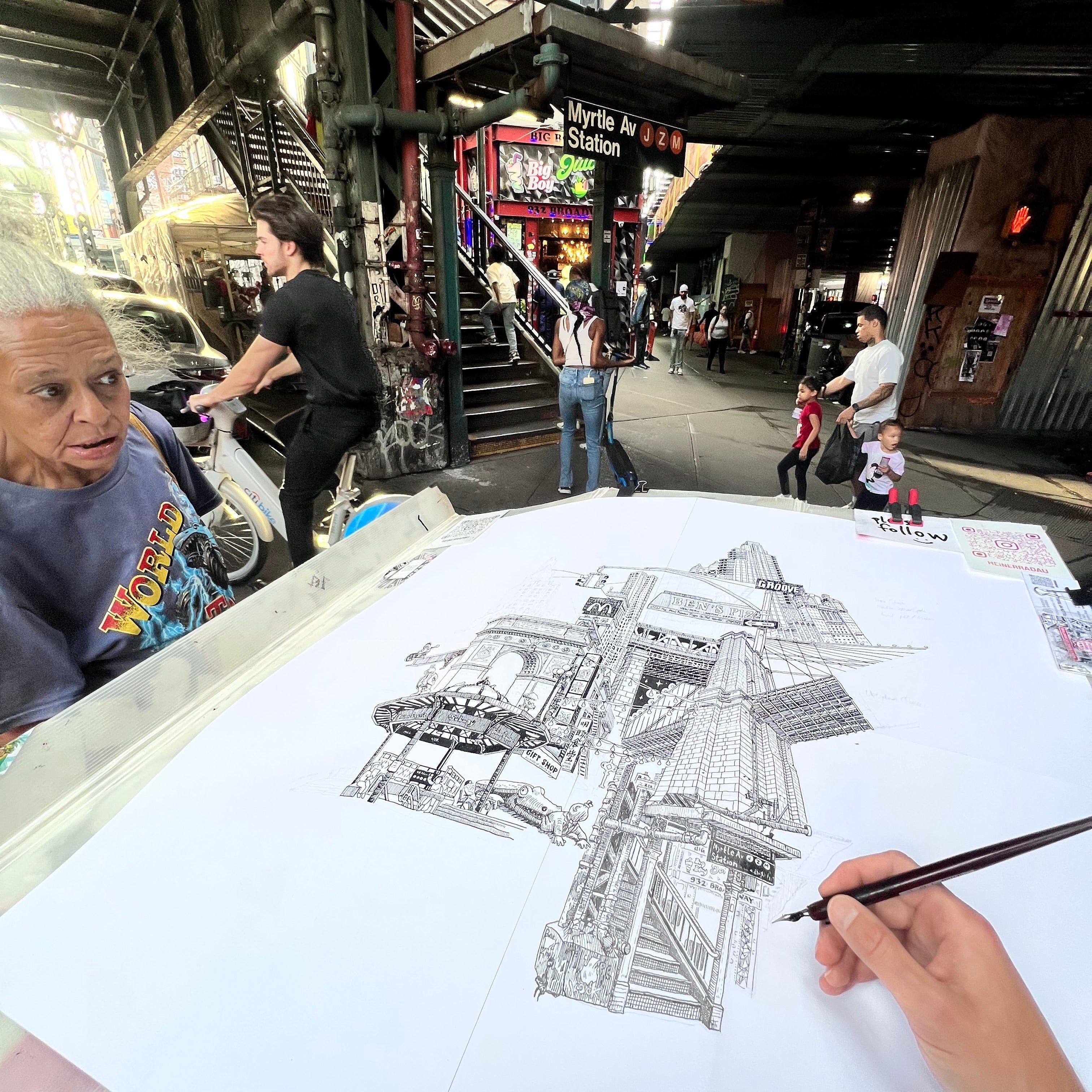 Person drawing a detailed architectural plan in an urban setting of MYRTLE AV brookyln nyc