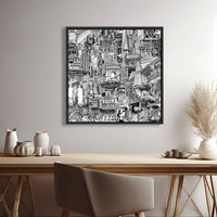 Black framed NYC canvas print above a desk, detailed New York wall art with Times Square, Katz’s, KAWS and subway references.