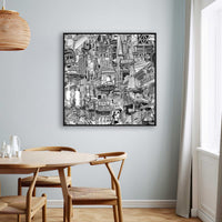 Black framed NYC canvas print on a dining room wall, shown as monochrome New York travel art with Chinatown, Union Square and subway elements.