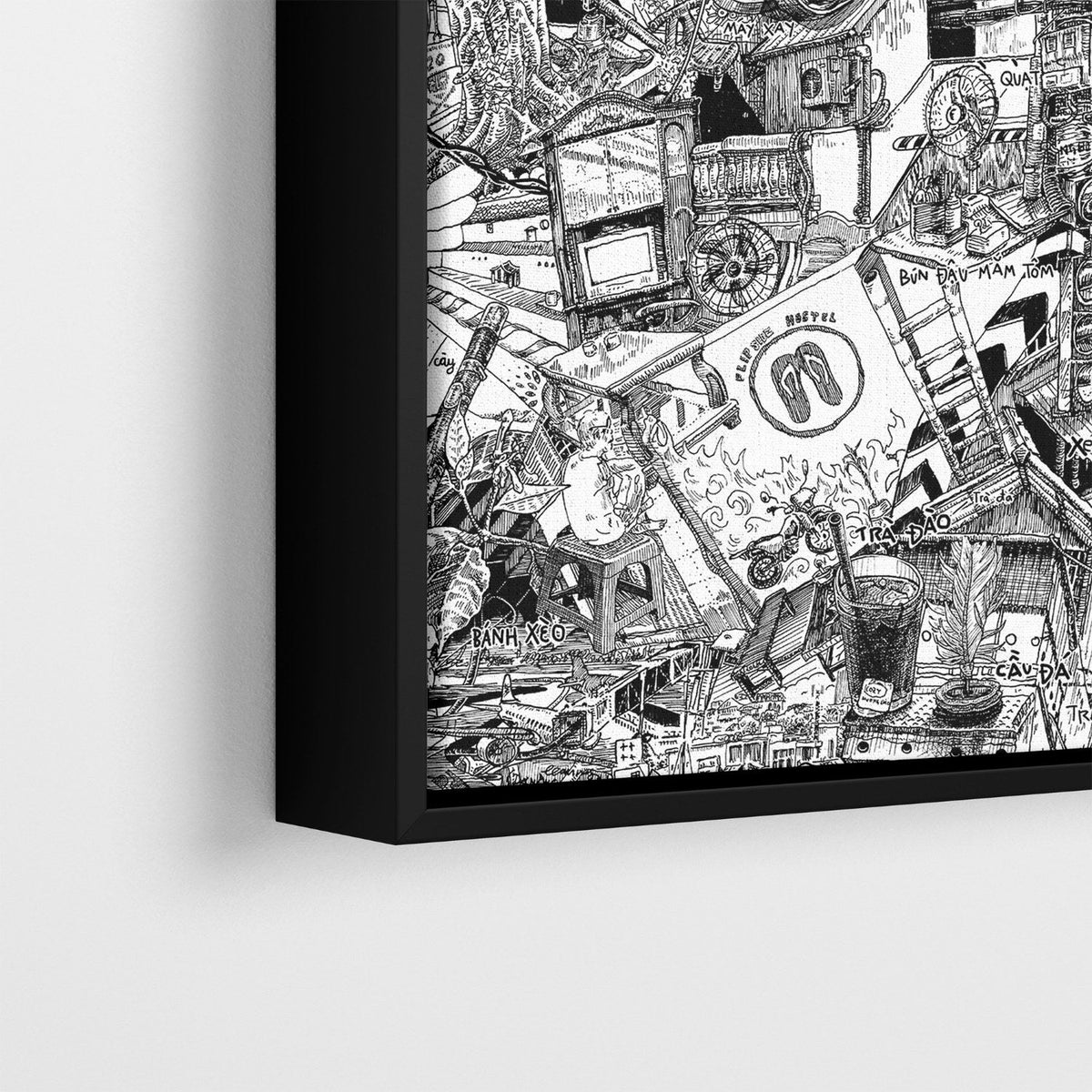 Matte black hardwood floater frame with shadow gap around a hand-drawn city canvas.