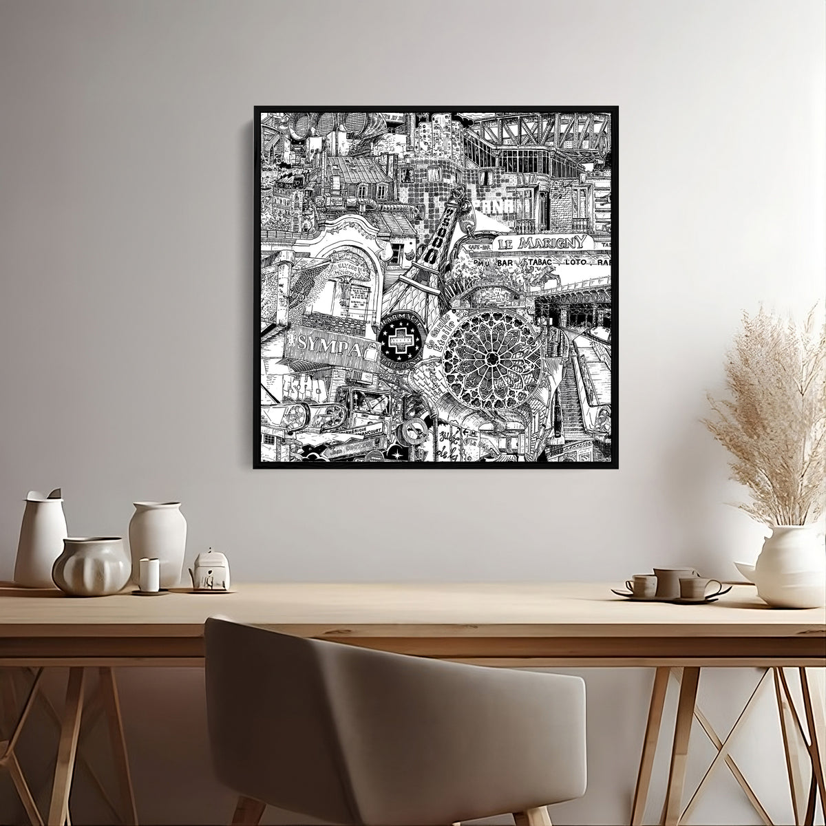 Black framed Paris art print above a desk, a detailed black and white architectural city drawing for home office wall decor.
