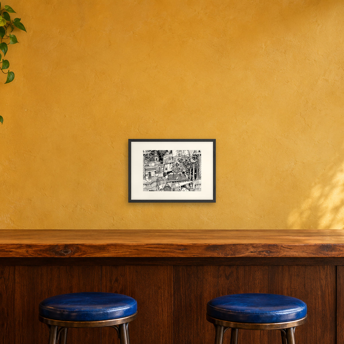 Valencia fine art poster A3 landscape in a black wood frame with white passepartout above a café bar counter