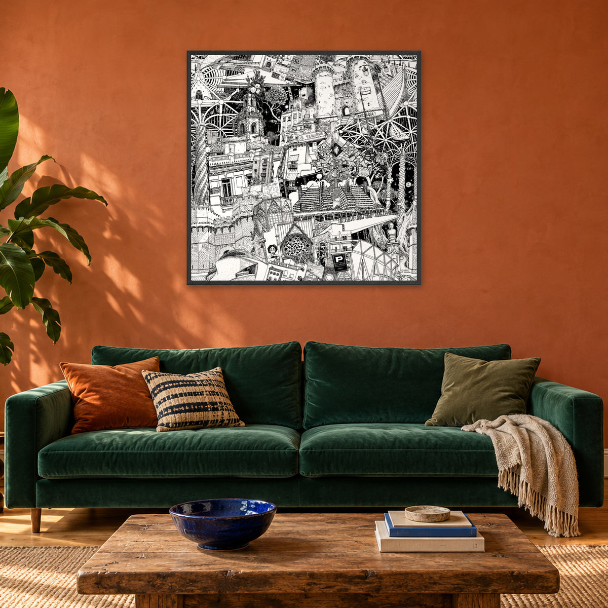 Valencia fine art poster 100 × 100 cm in a black wood frame above a green velvet sofa in a terracotta living room